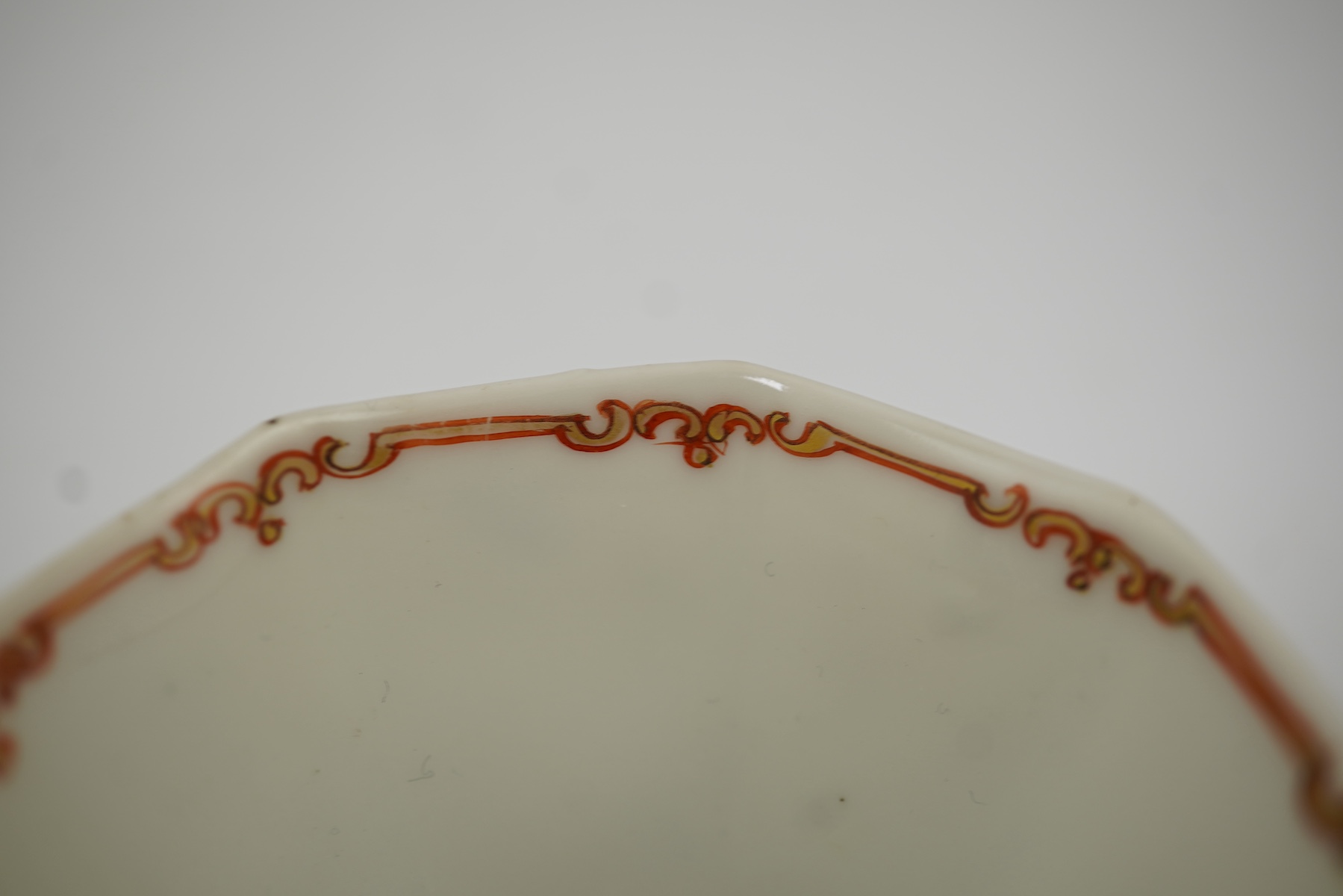 Two Chinese semi-eggshell porcelain hexagonal saucers and a similar cup, Yongzheng/Qianlong period